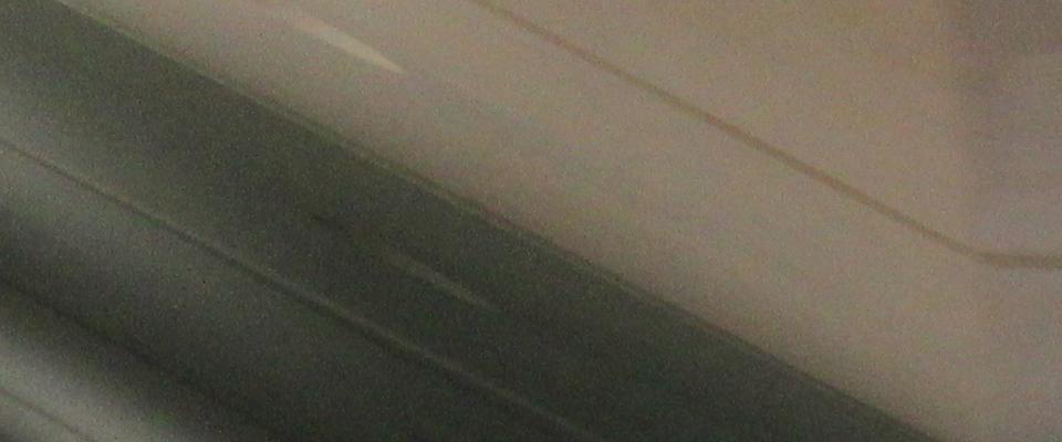 Two speakers presenting in front of a screen