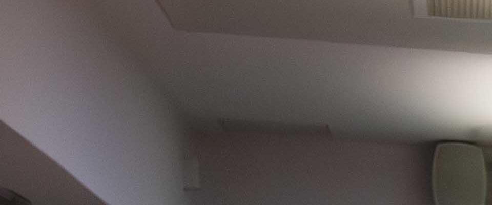 Group of people discussing projects sitting down at desks