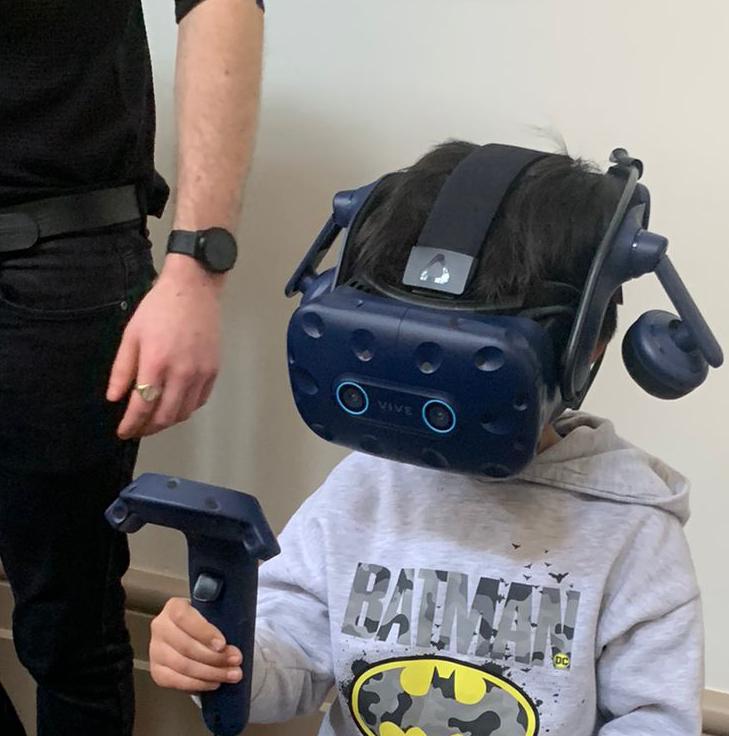 Child with a headset on their head.