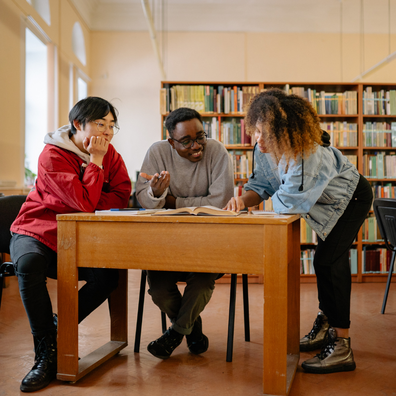 A group of three adults having a discussion.