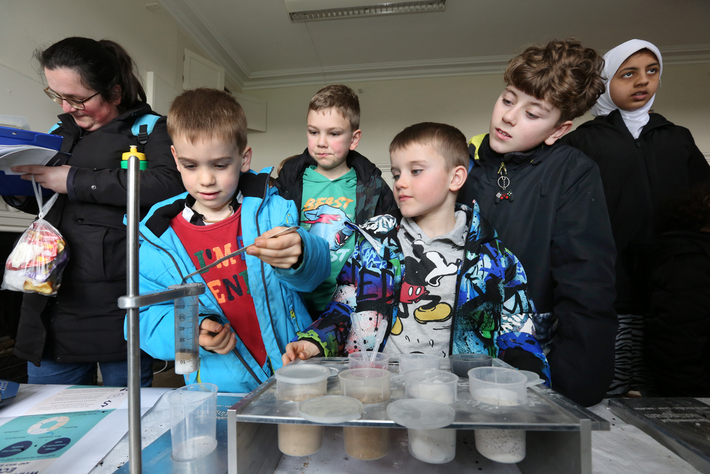 4 boys at an exhibit no 2