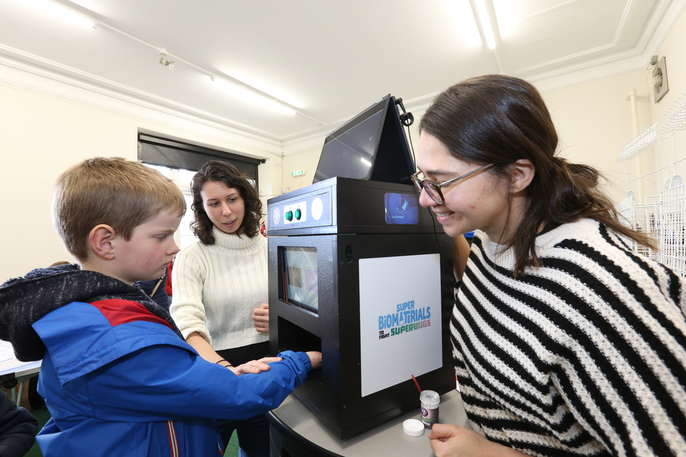 Boy and exhibitor at a stand 2