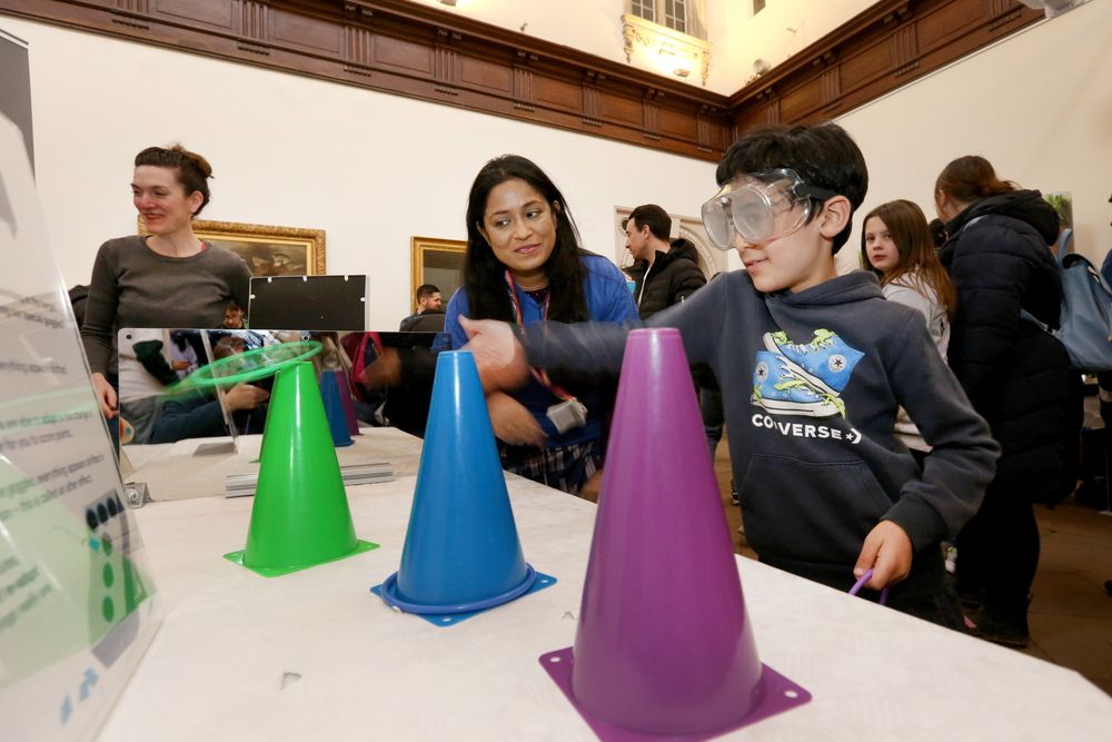 Boy in googles at an exhibition stand