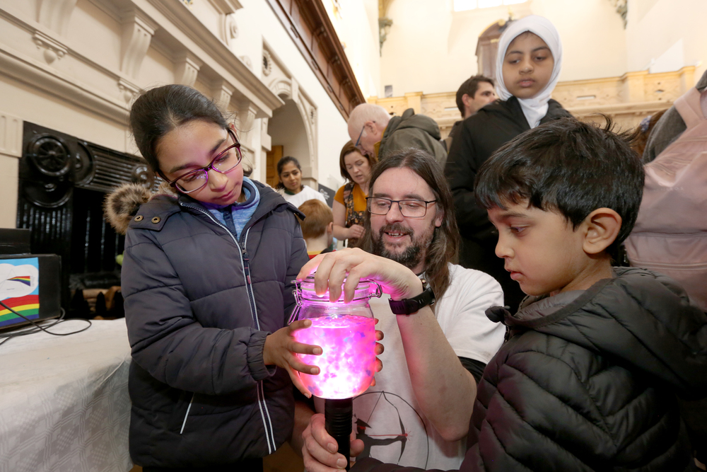 Girl and boy at an exhibition stand