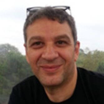 Photo of a man smiling in a t-shirt