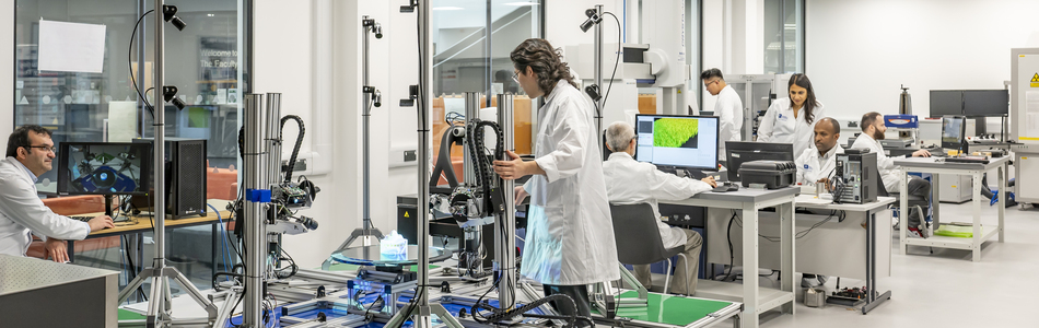 Manufacturing Metrology Team members working in the commercial lab