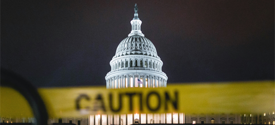 House of Congress at night behind yellow tape with text "Caution" on it