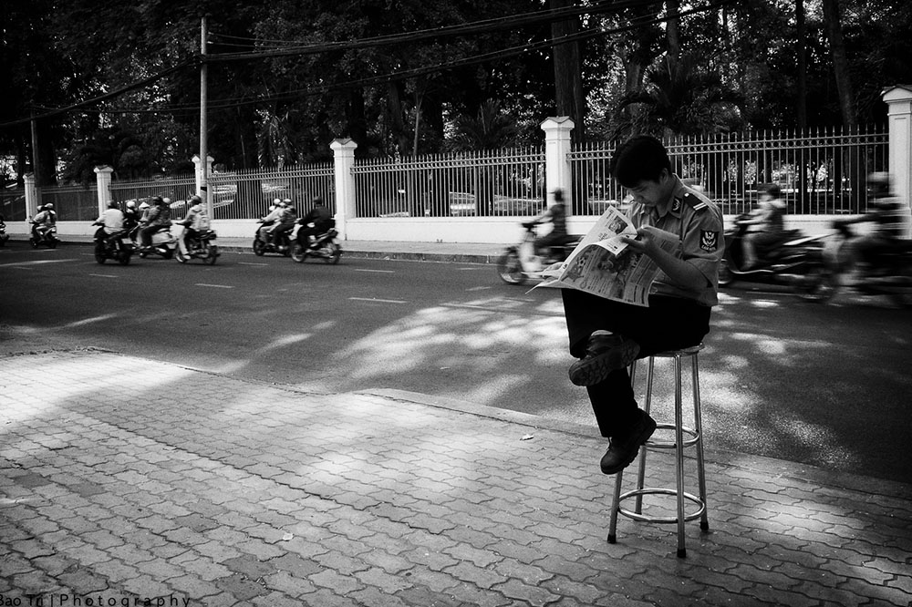 man with newspaper