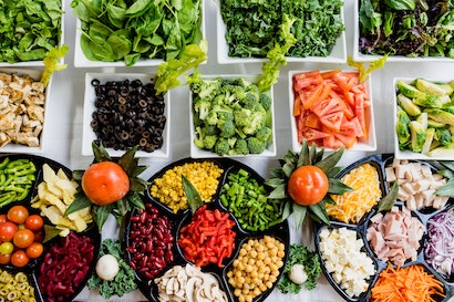 Plates of colourful individuals salad foods - image taken by Dan Gold from Unsplash