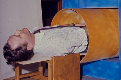 Sir Peter Mansfield in a model MRI scanner