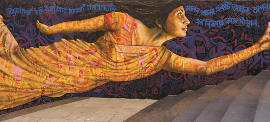 Rights Lab mural of a women with her hand stretched out