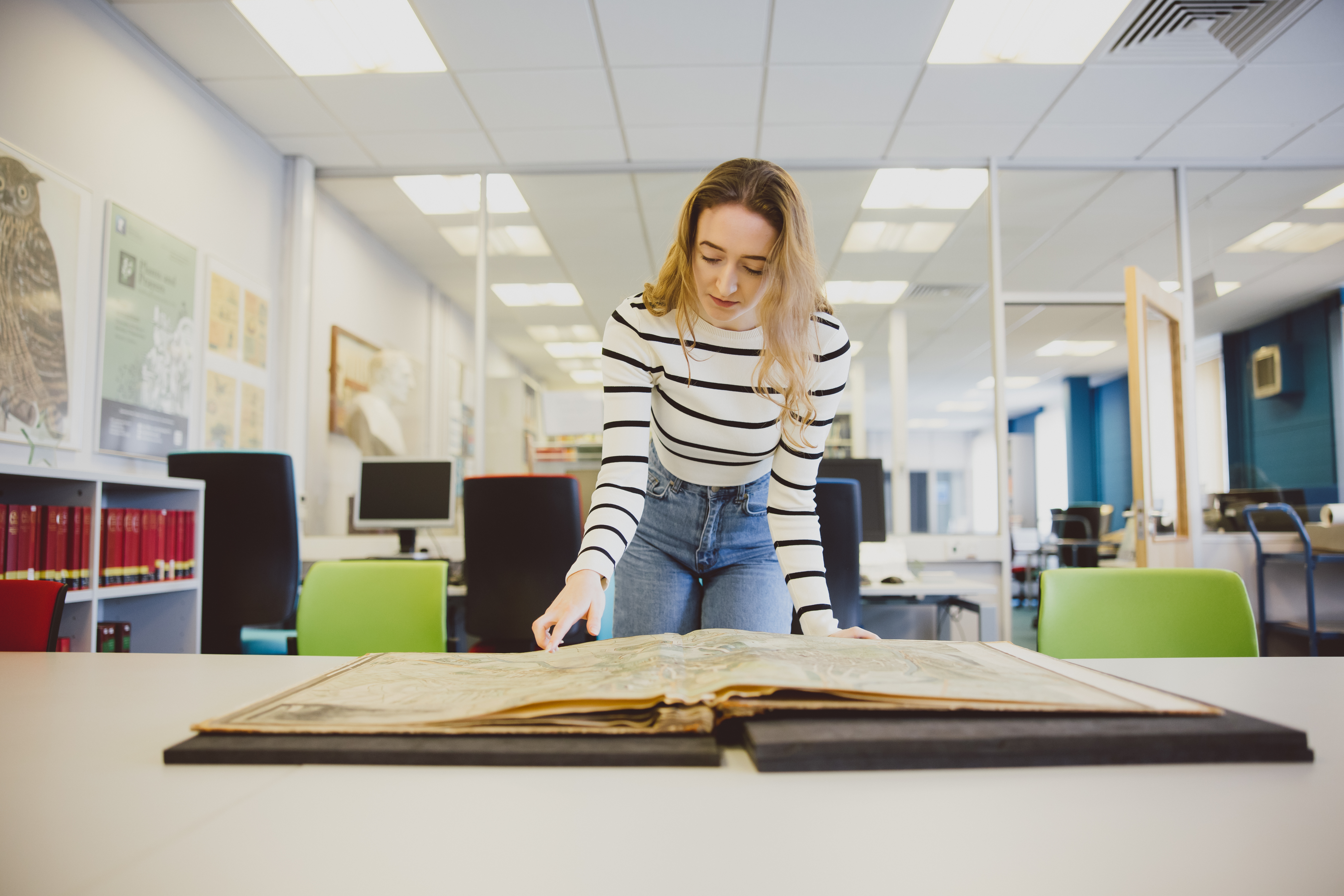 Researcher reading manuscripts