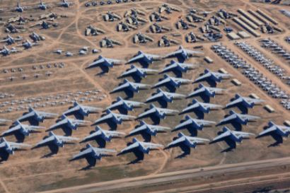 Aerial photograph of planes parked closely together on an airfield