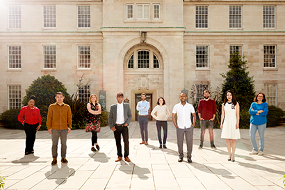 Group of 10 research fellows in Trent building courtyard