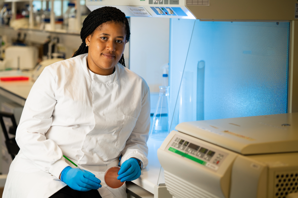 Doctoral Training Programme research student working in laboratory