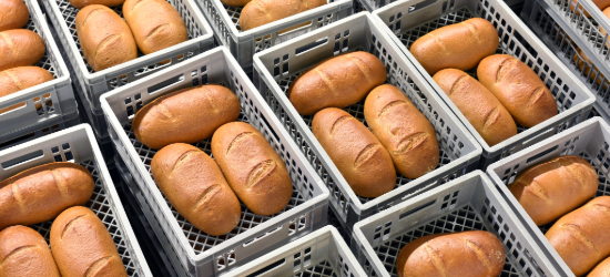 storage and transport of freshly baked loaves of bread in a bakery for sale - industrial food production