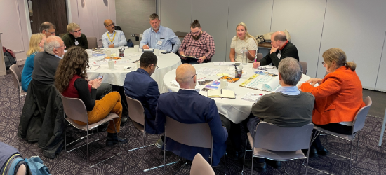 Food and drink professionals brainstorming around a table