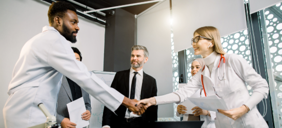 People shaking hands after a meeting