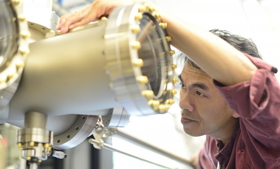 A physics student examines a molecular beam