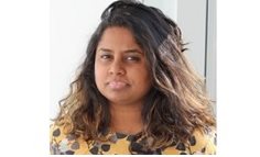 Image of Sobana Wijeakumar with dark curly hair and a yellow top