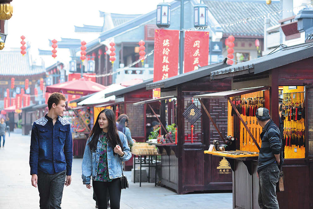 students walking through market in China