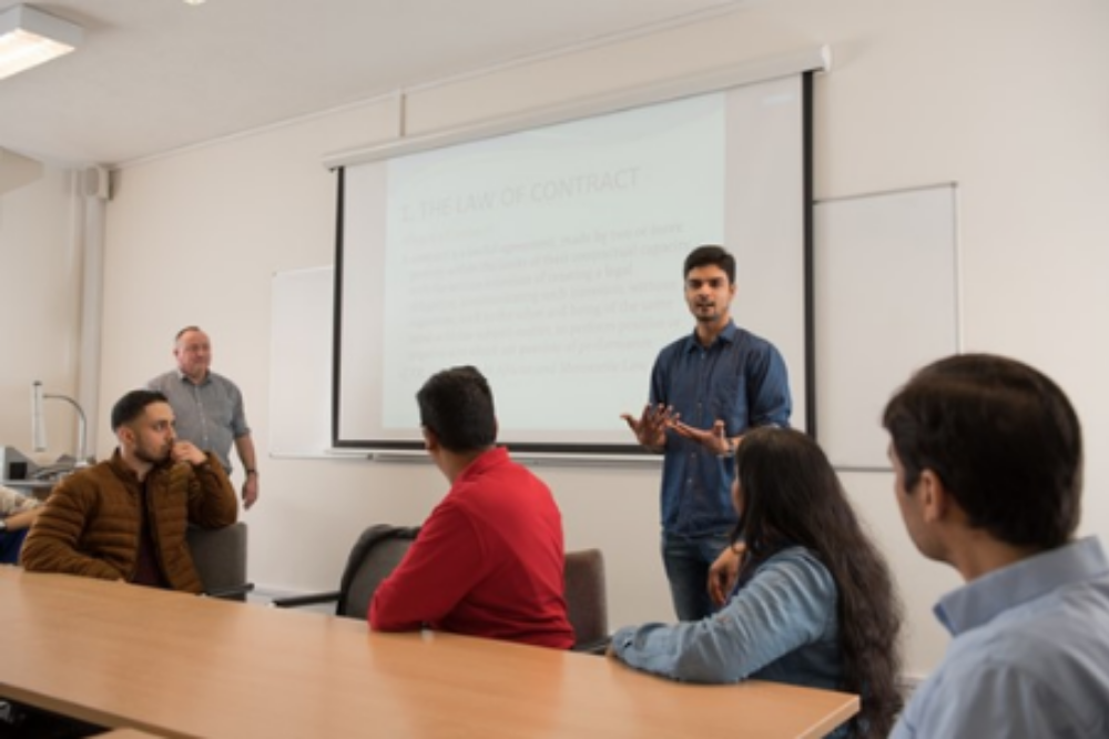 A student presenting their work in a seminar