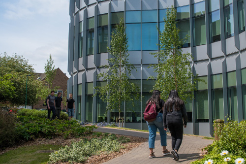 Students outside the George Green Library building on University Park Campus