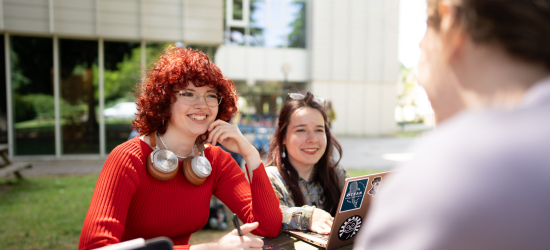 Undergraduate students studying outside the Monica Partridge Building