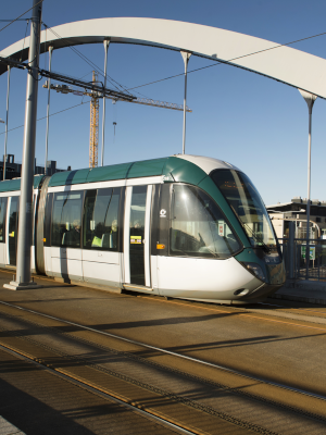 Tram crossing bridge outside University