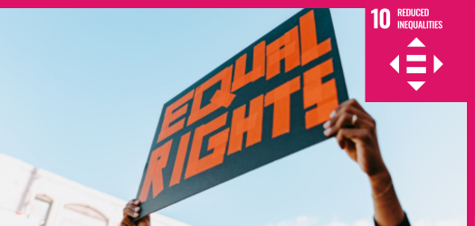 Equal Rights sign held in the air with the sky in the background