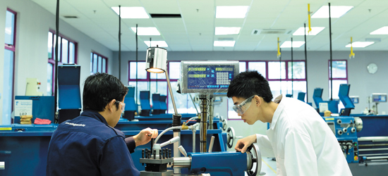 Two technician students working in lab